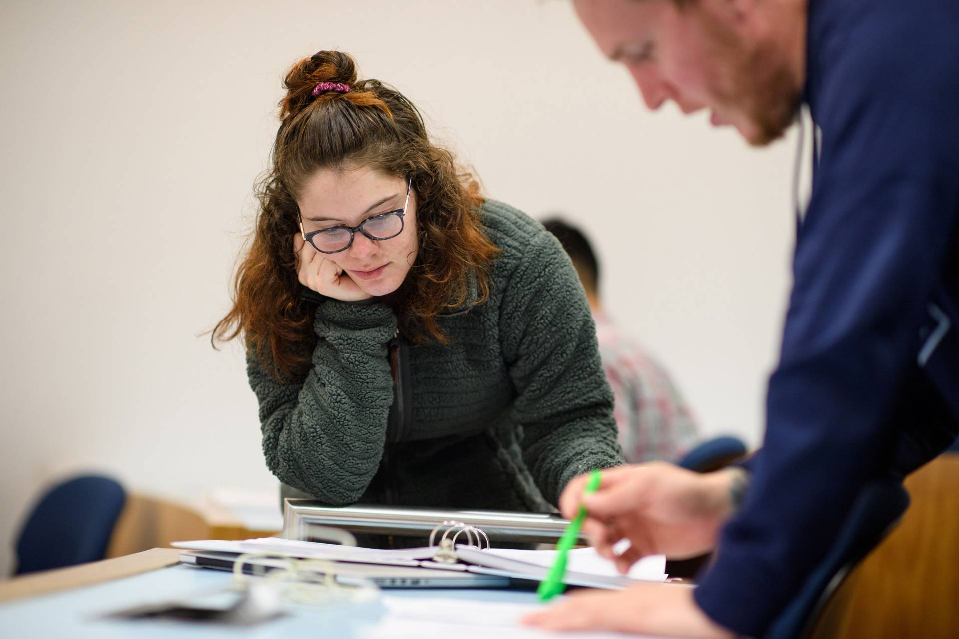 Rhiannon Freitag looking at papers on table
