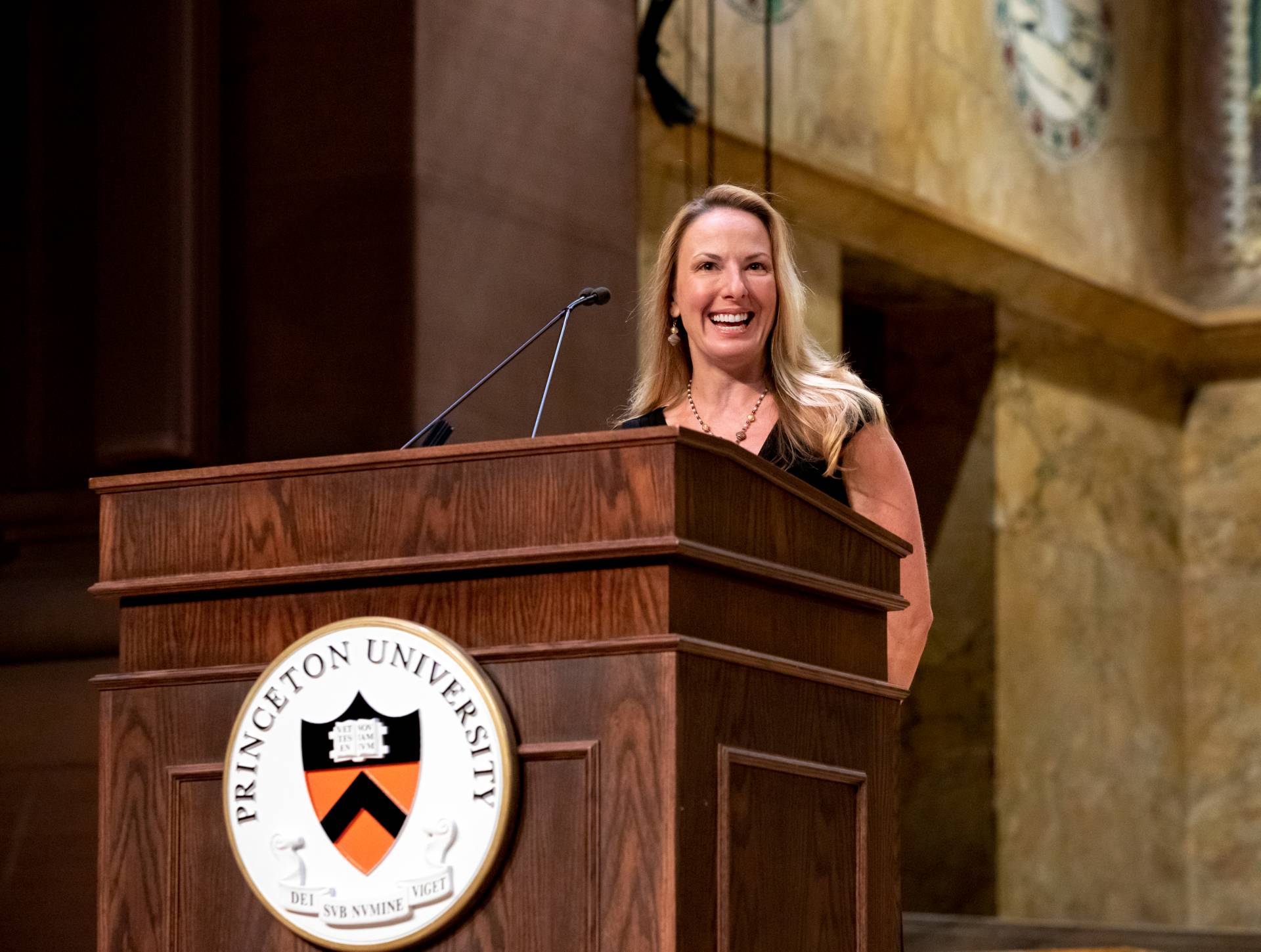 Sarah-Jane Leslie standing at podium speaking