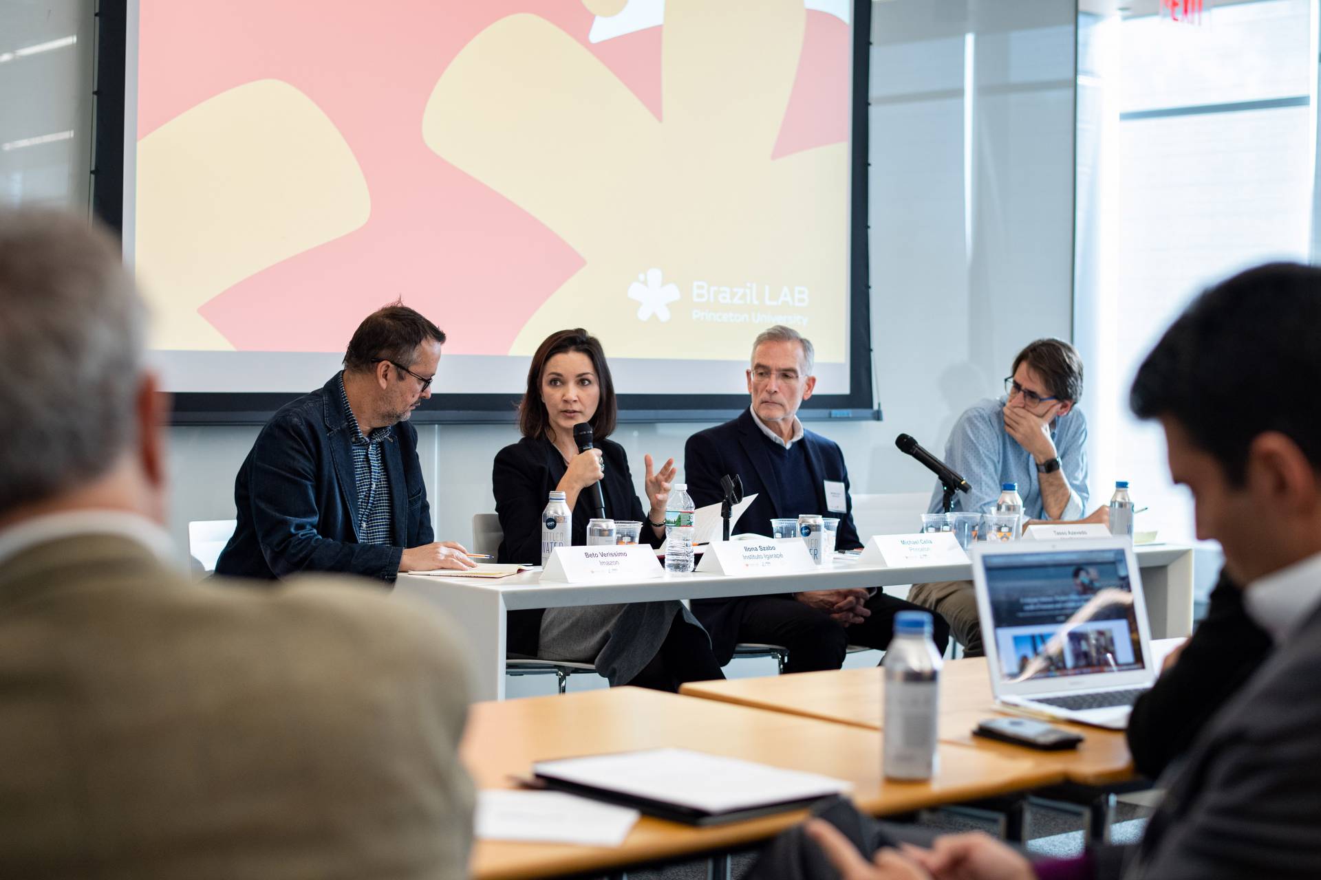 Four people speak on a panel