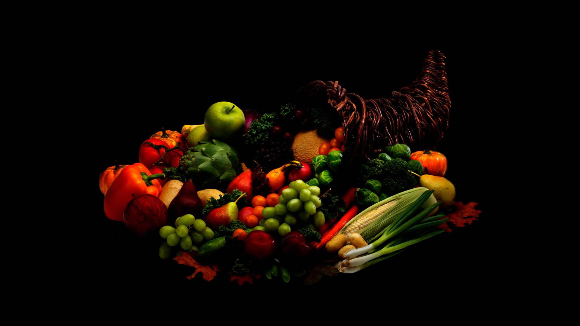 A conical basket is filled with a bounty of fruit and vegetables
