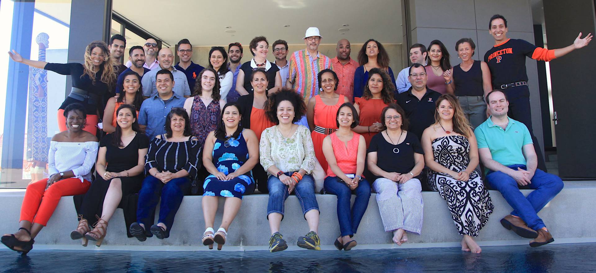 Kwanza Jones and José E. Feliciano flank the attendees 
