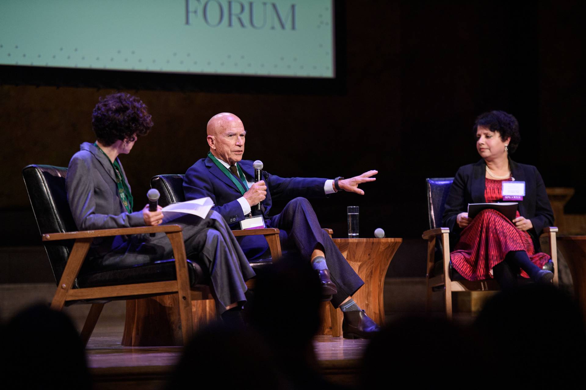 Ferenbach gesticulates while speaking at  the PEI event