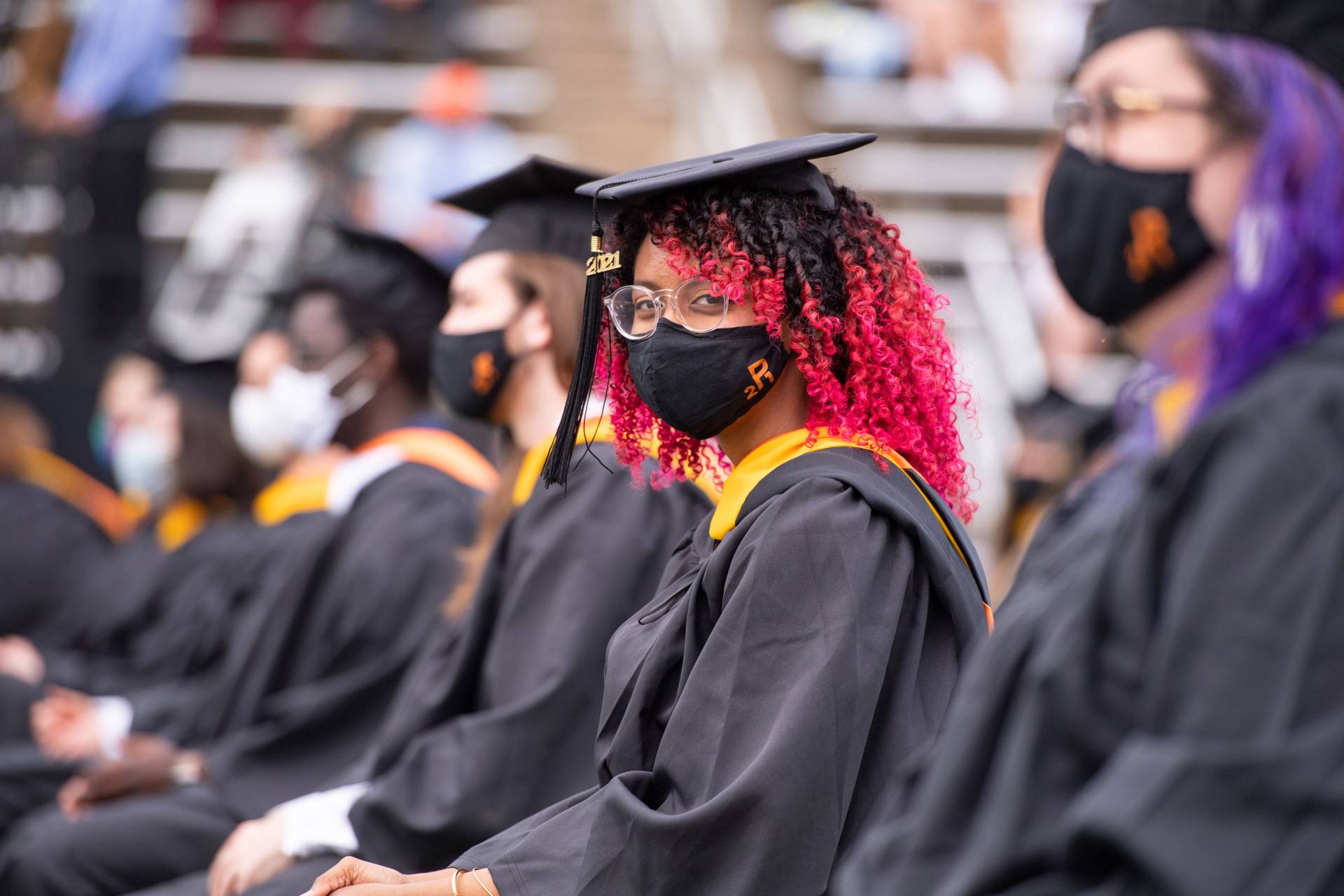 Undergraduates sit at their places in the stadium
