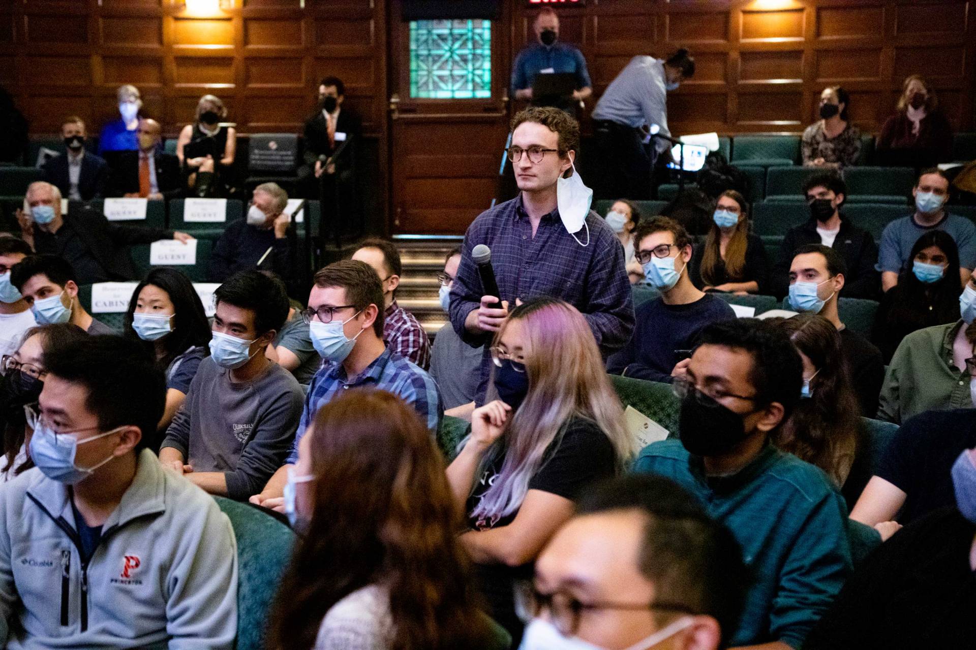 A student asks a question during the press conference at Richardson Hall