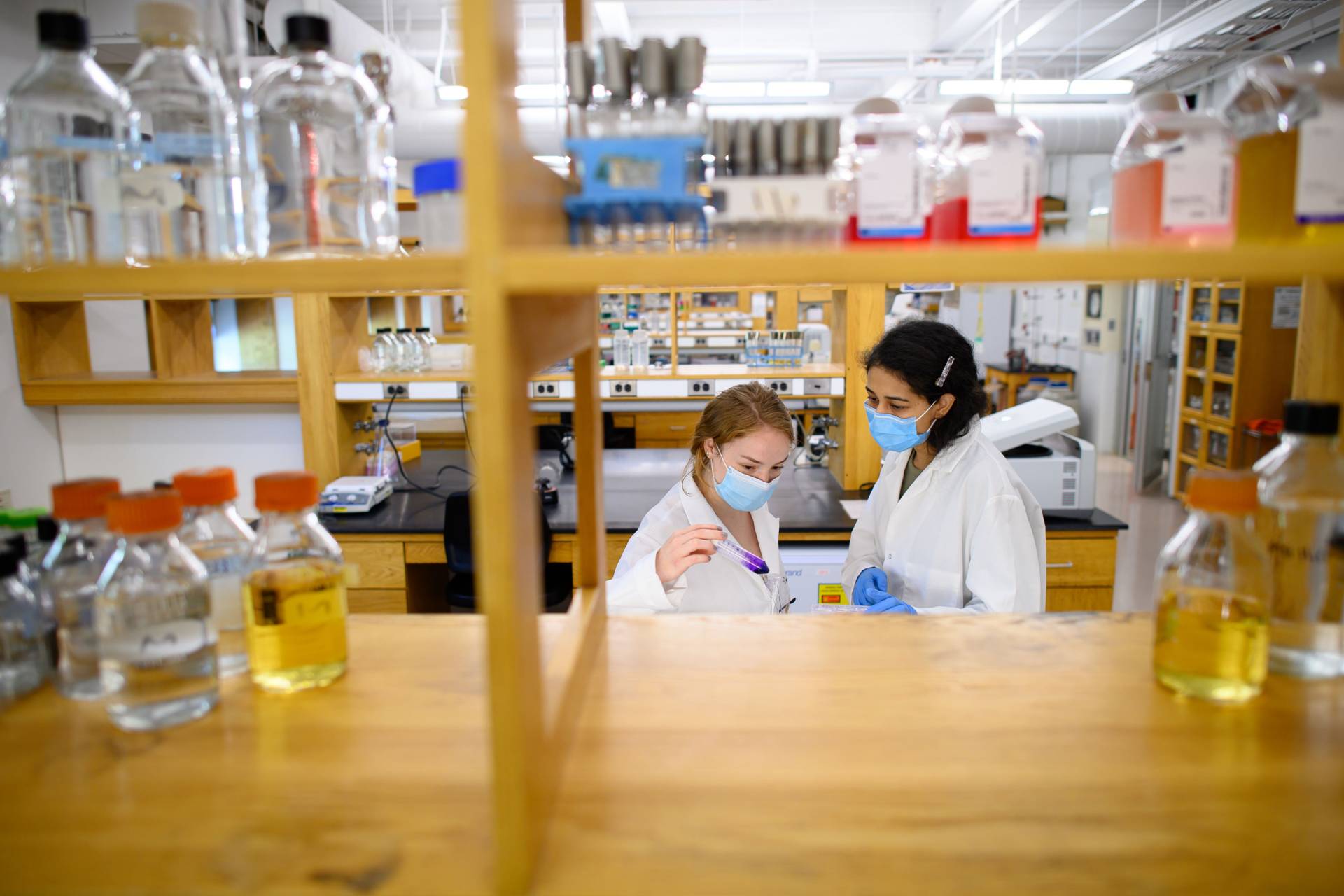 Kimberly Sabsay and Karishma Bisht work in the lab