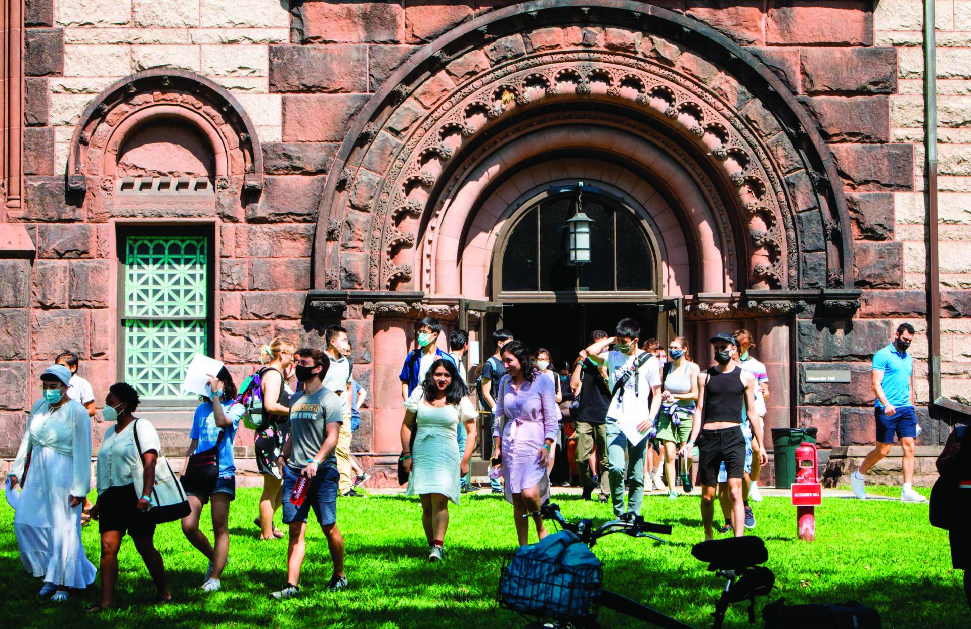 Graduate students stream out of Alexander Hall, after an orientation event