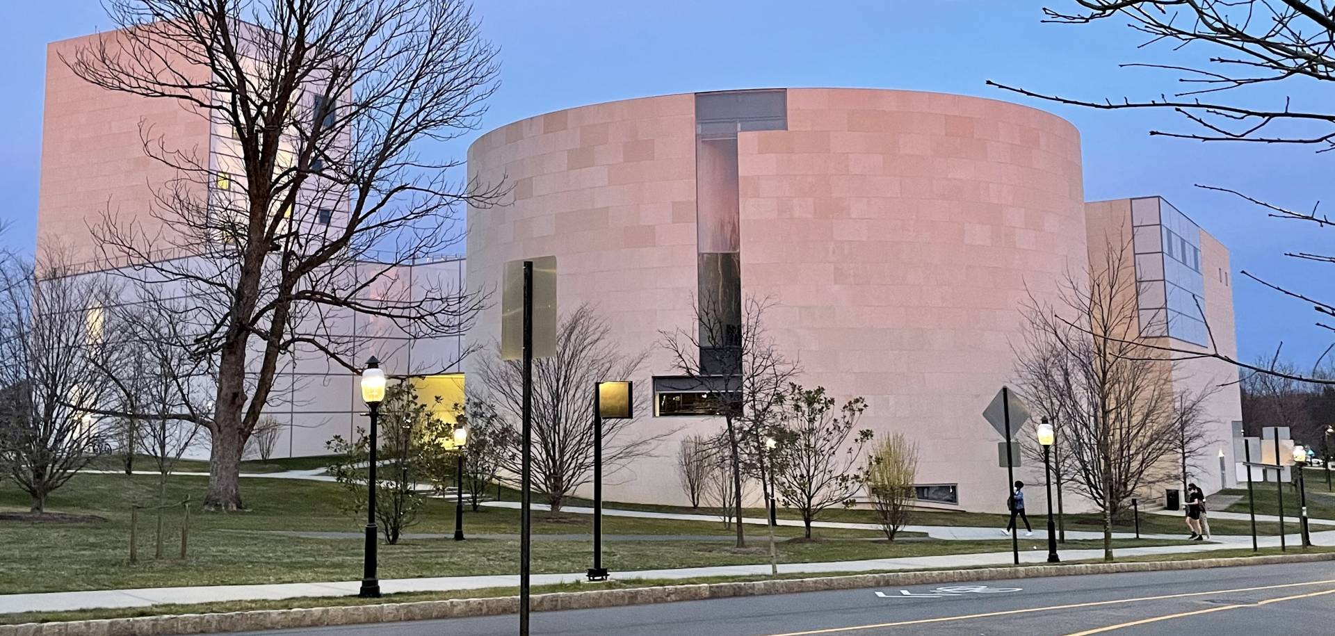 Lewis Center for the Arts buildings shaded pink by the sunset.