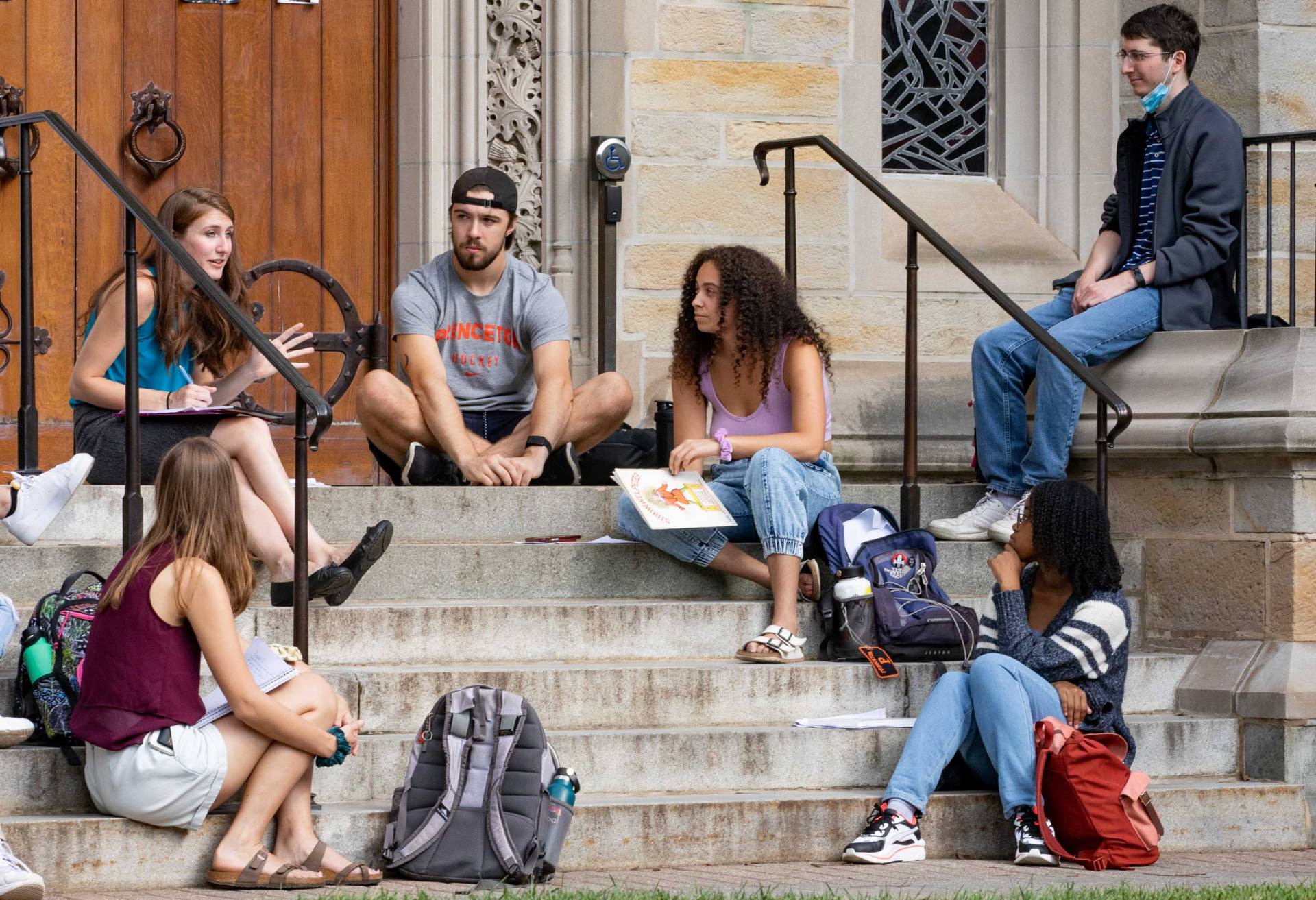 Students participate in class discussion on steps