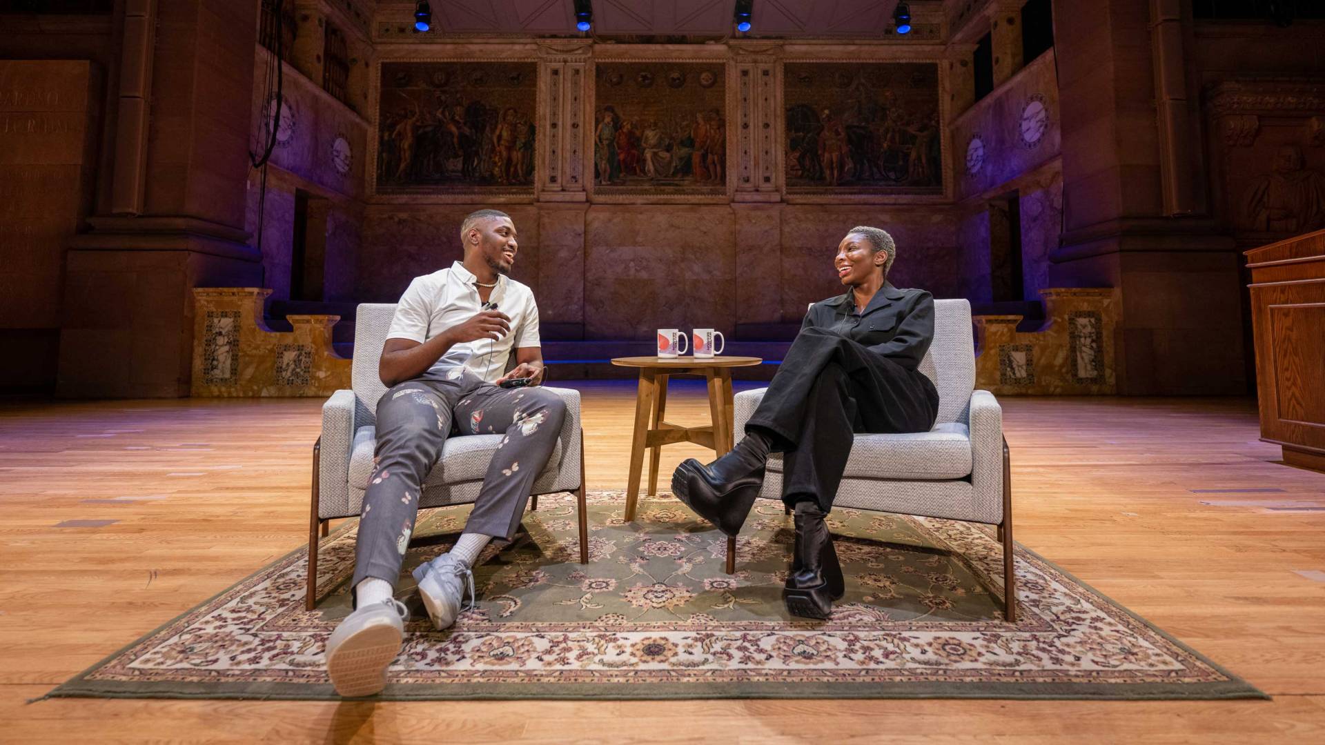 Michaela Coel speaks to a student during a Wintersession event