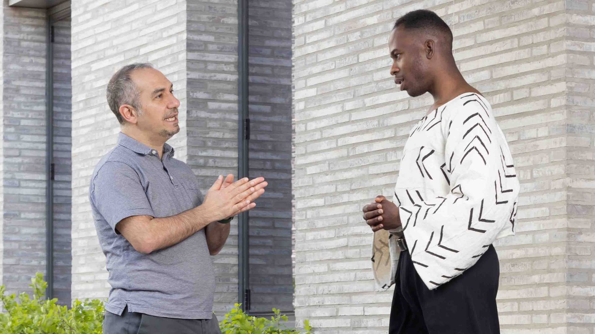 Jovan in conversation with his adviser.