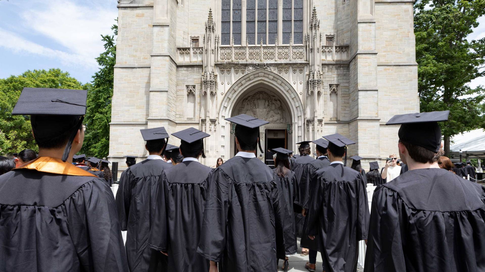 Graduates process into the chapel