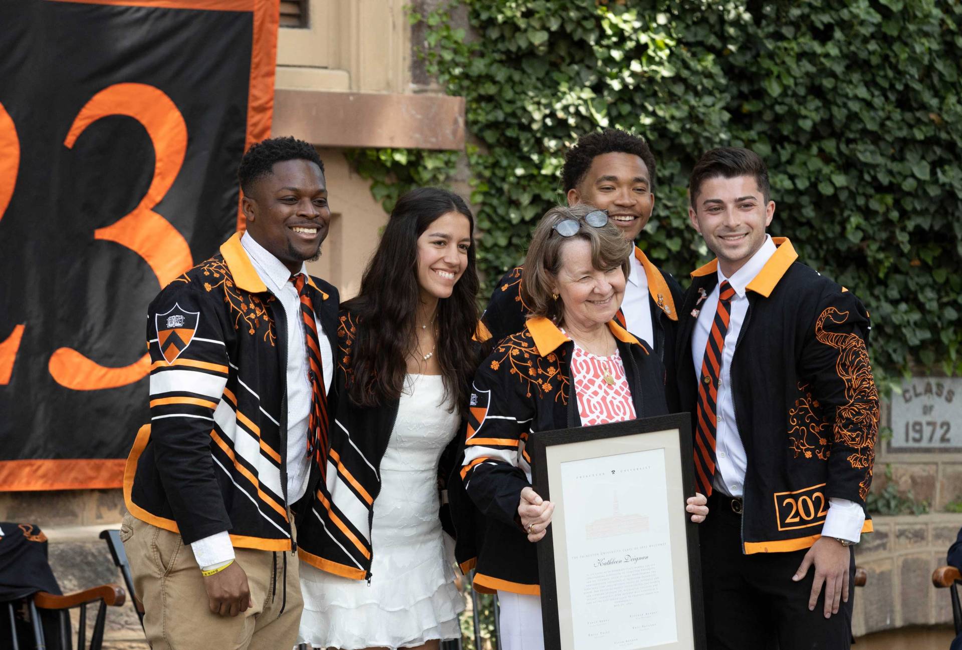 Students pose with an honorary member of the Class of 2023