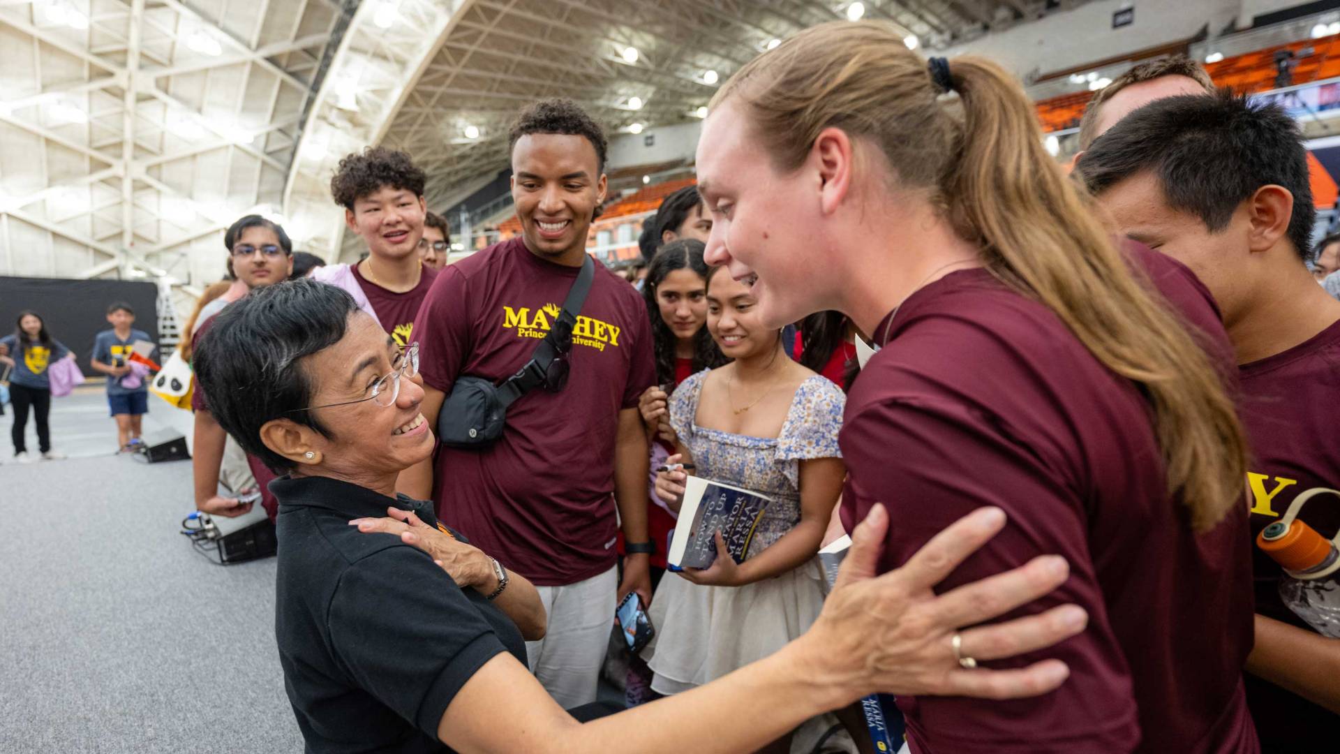 Maria Ressa has a light moment with students