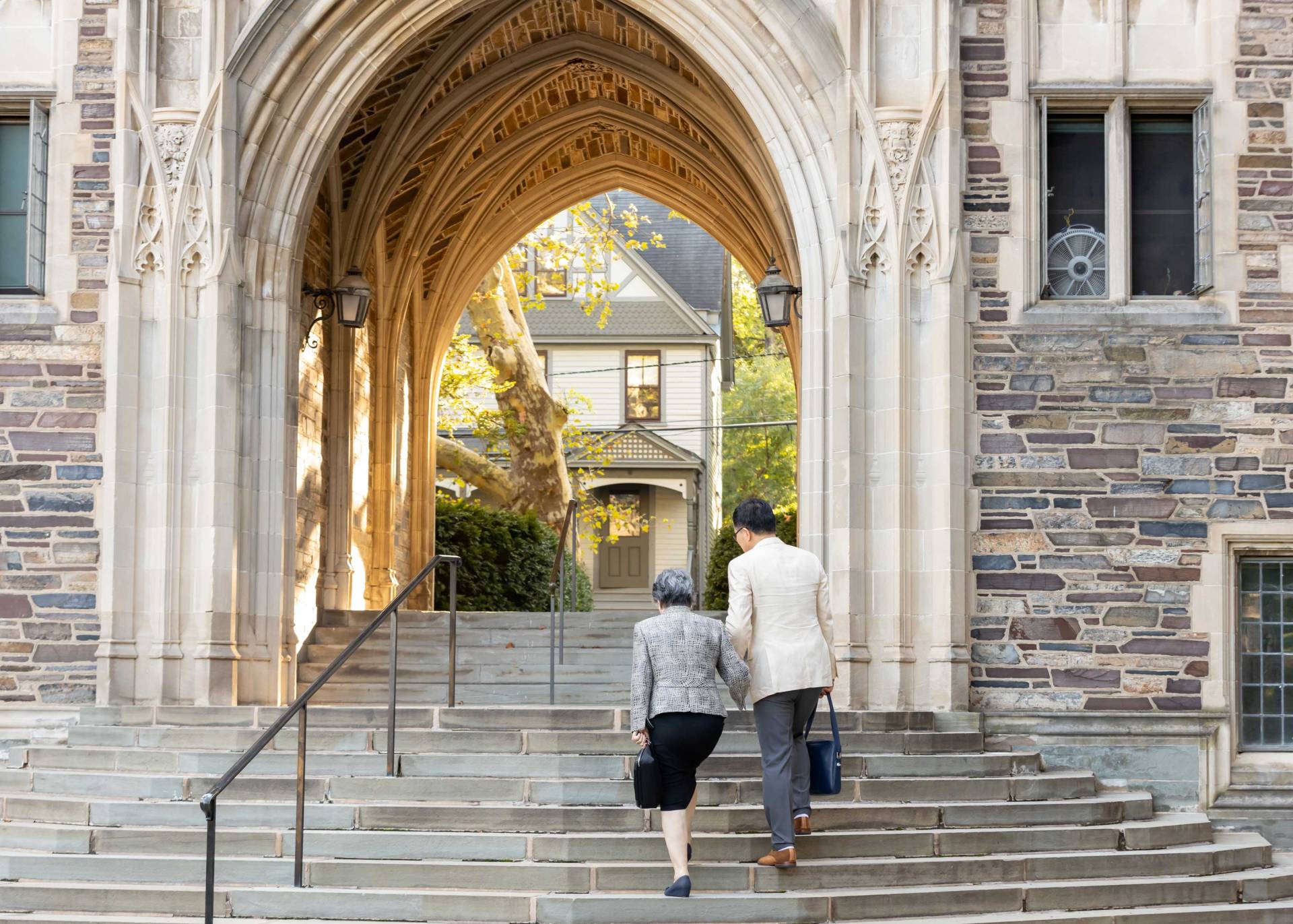 Ikeda Arch with Ikeda's family walking towards it.
