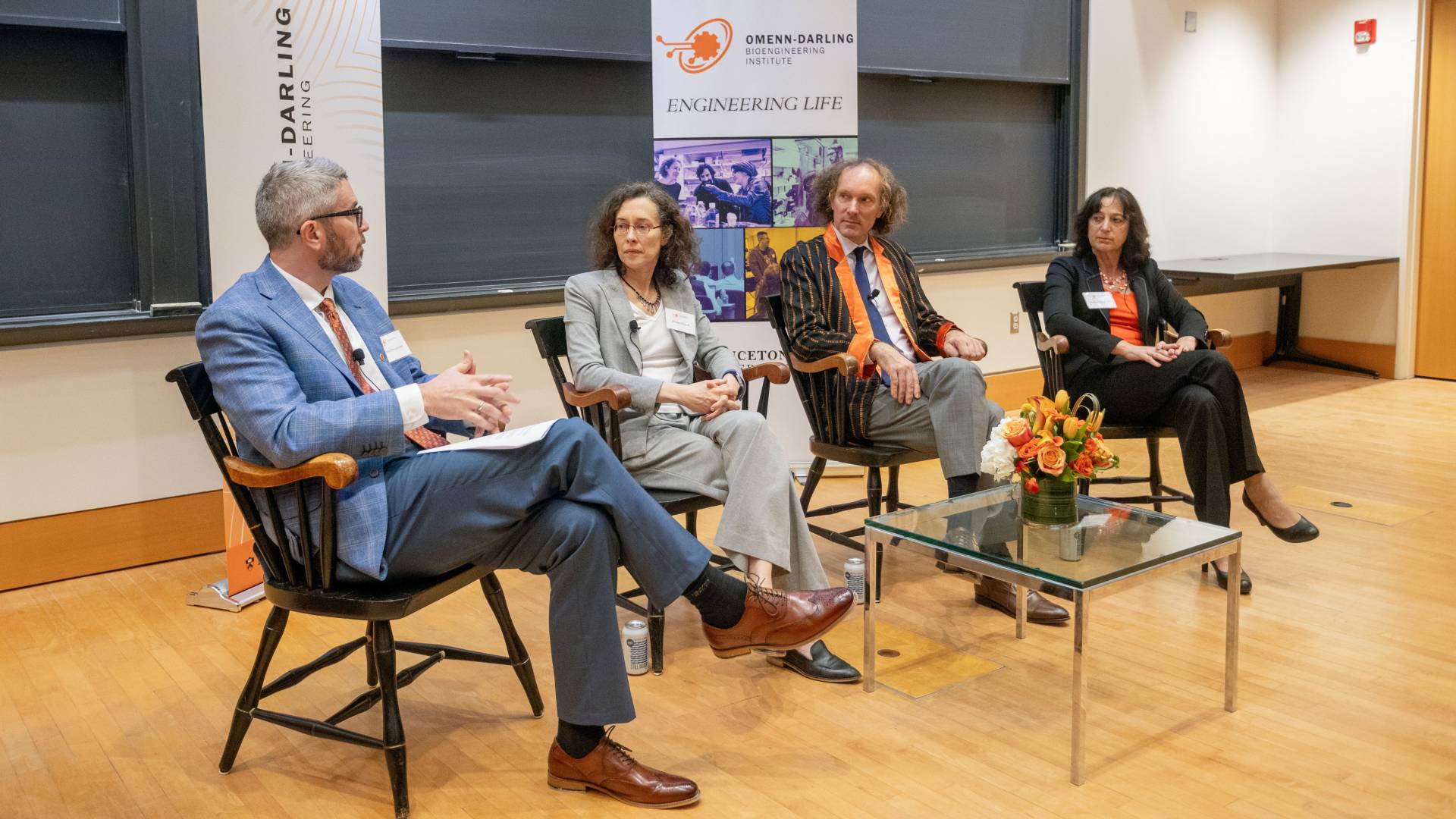 a panel of four speakers