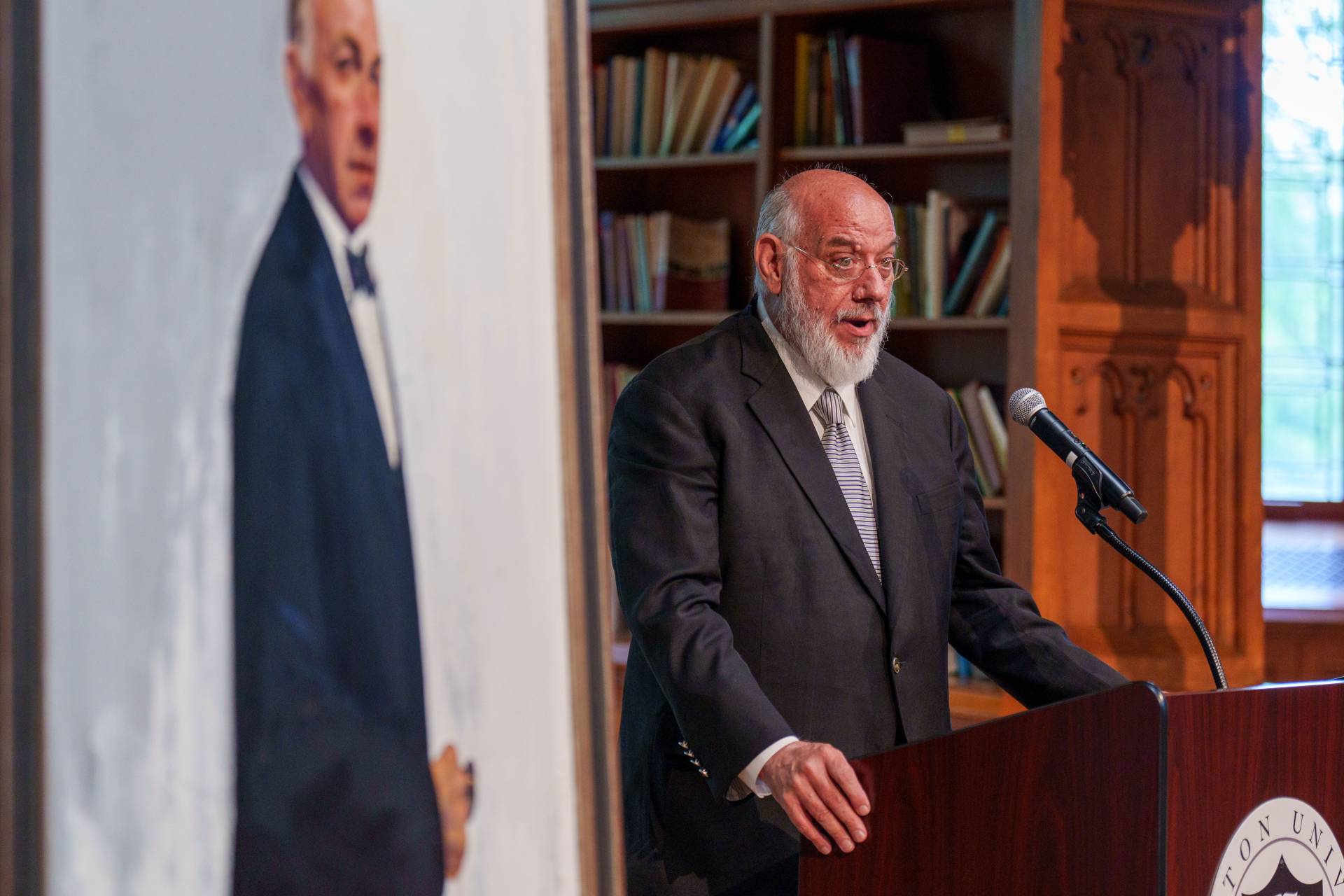 One of Jose Ferrer's sons speaks at the podium next to his father's portrait