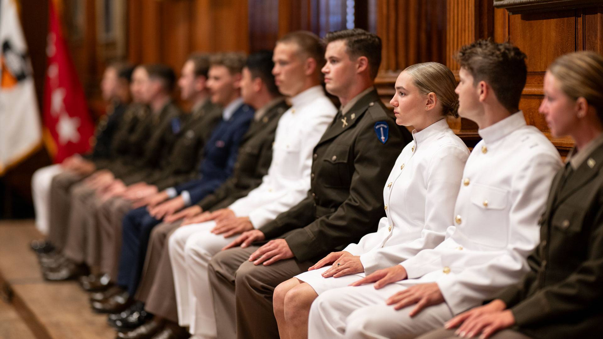Newly commissioned officers listen attentively at the ceremony.