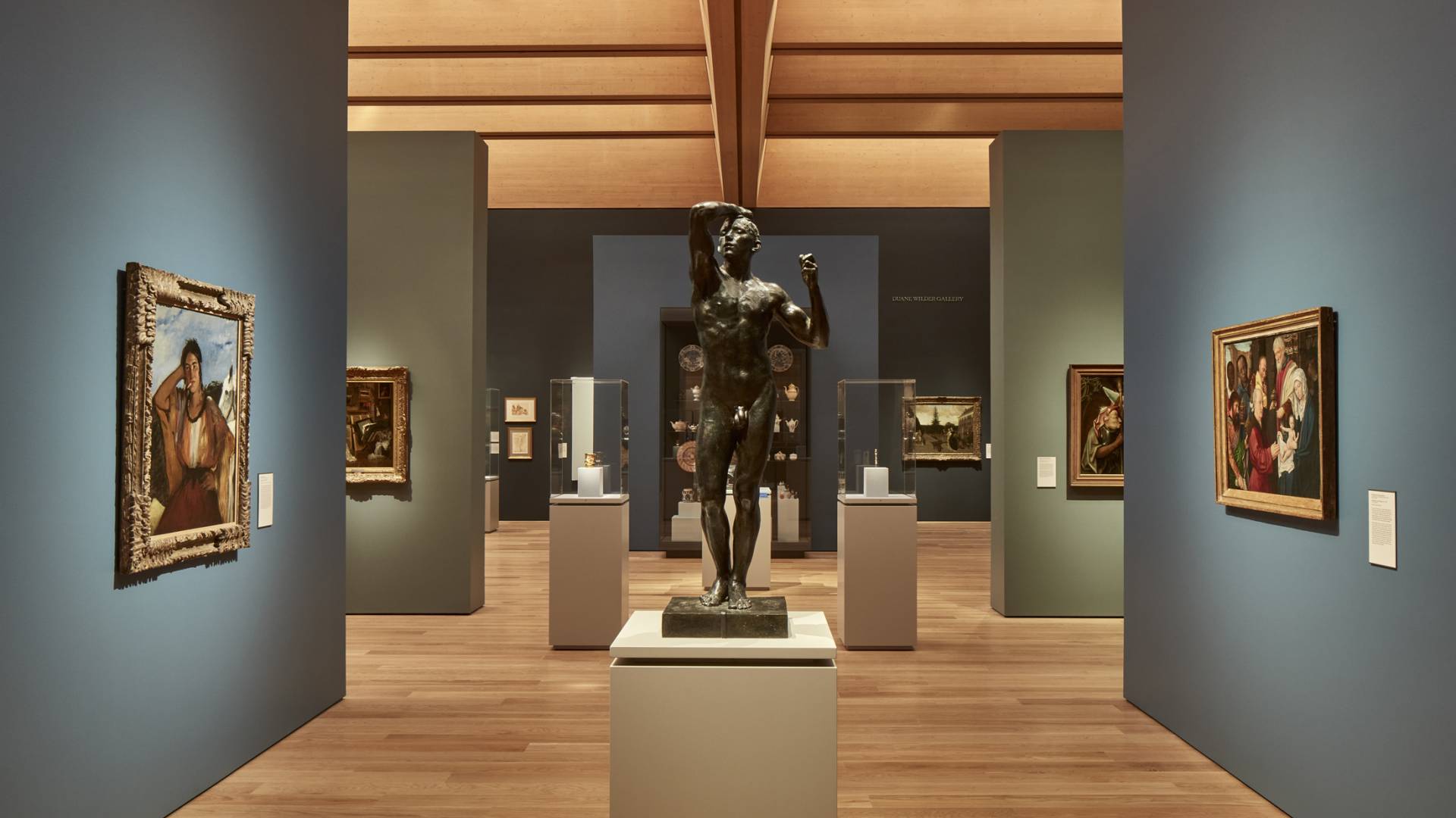 A scultpure and paintings on display in the European Wing