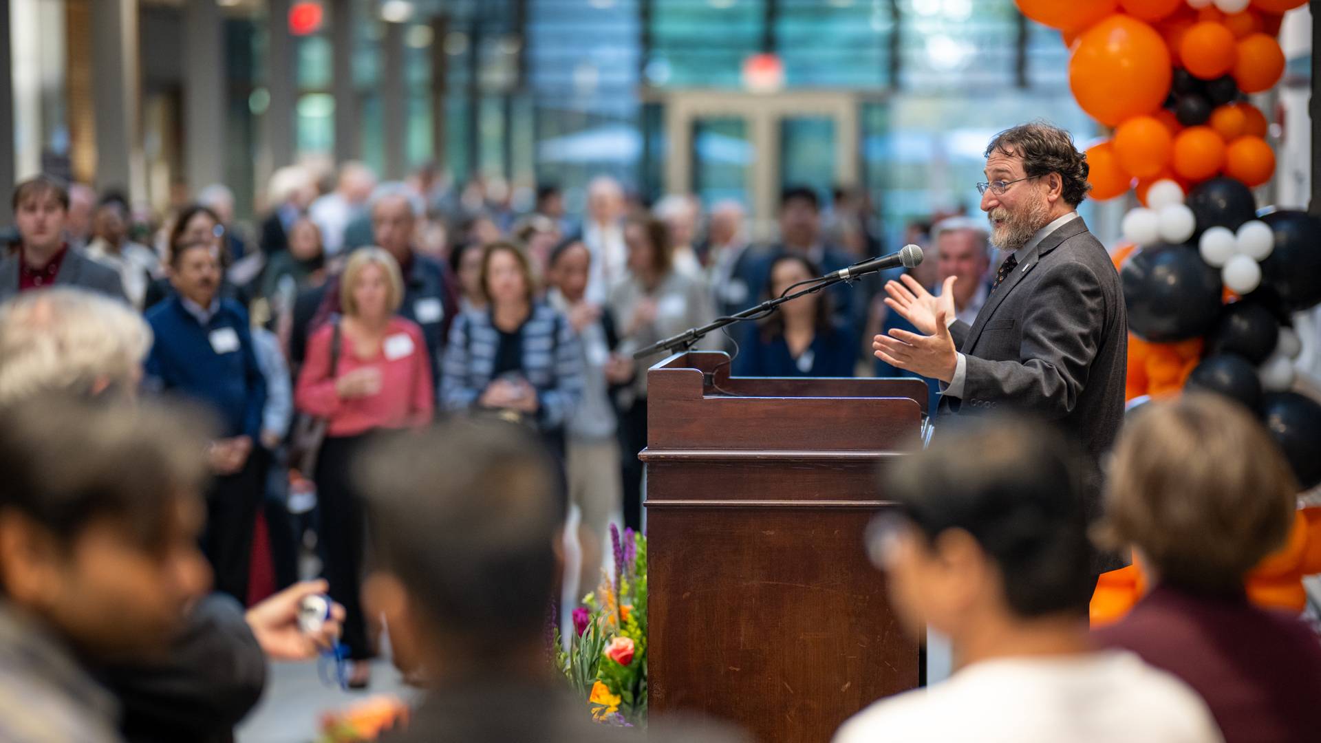 Vice dean for Innovation Craig Arnold speaks at a podium, addressing attendees.