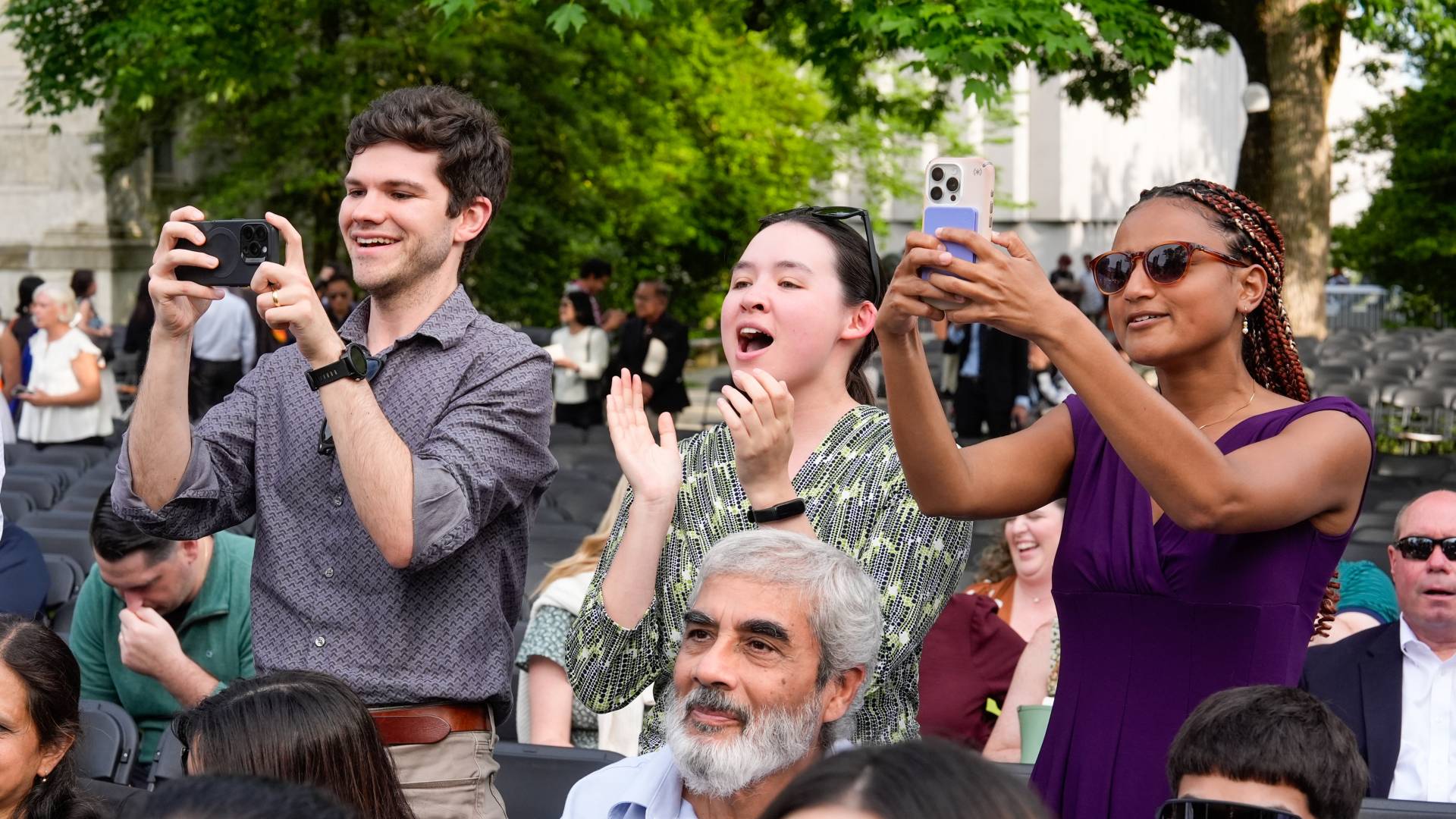 Cheering people stand up