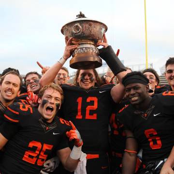 Football team holding a trophy