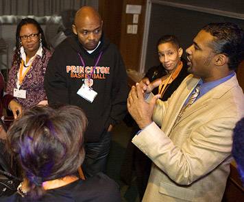 alumni talking with Angel Harris