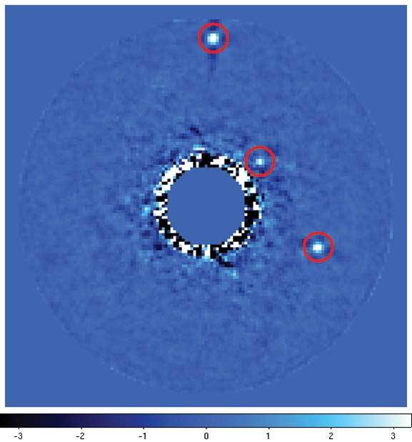 a plot of data from CHARIS shows planets located around a star in the planetary system HR8799