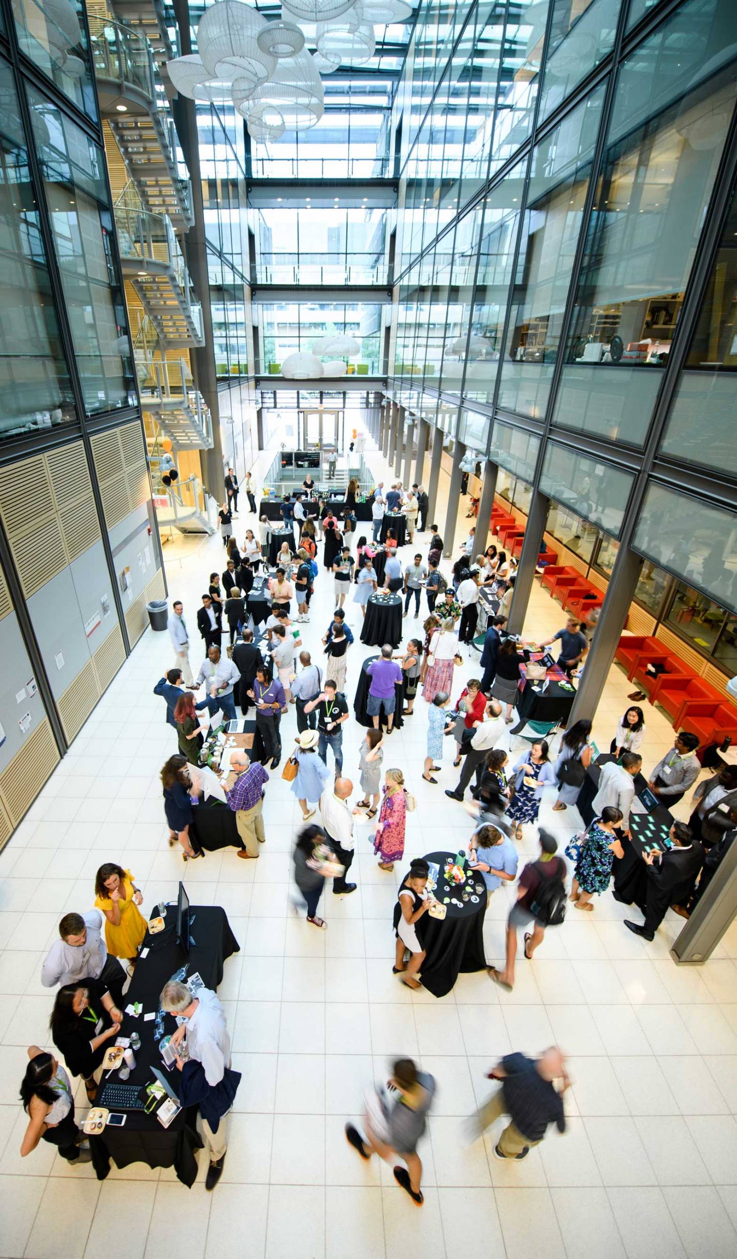 People chat during a reception in Frick Chemistry building.