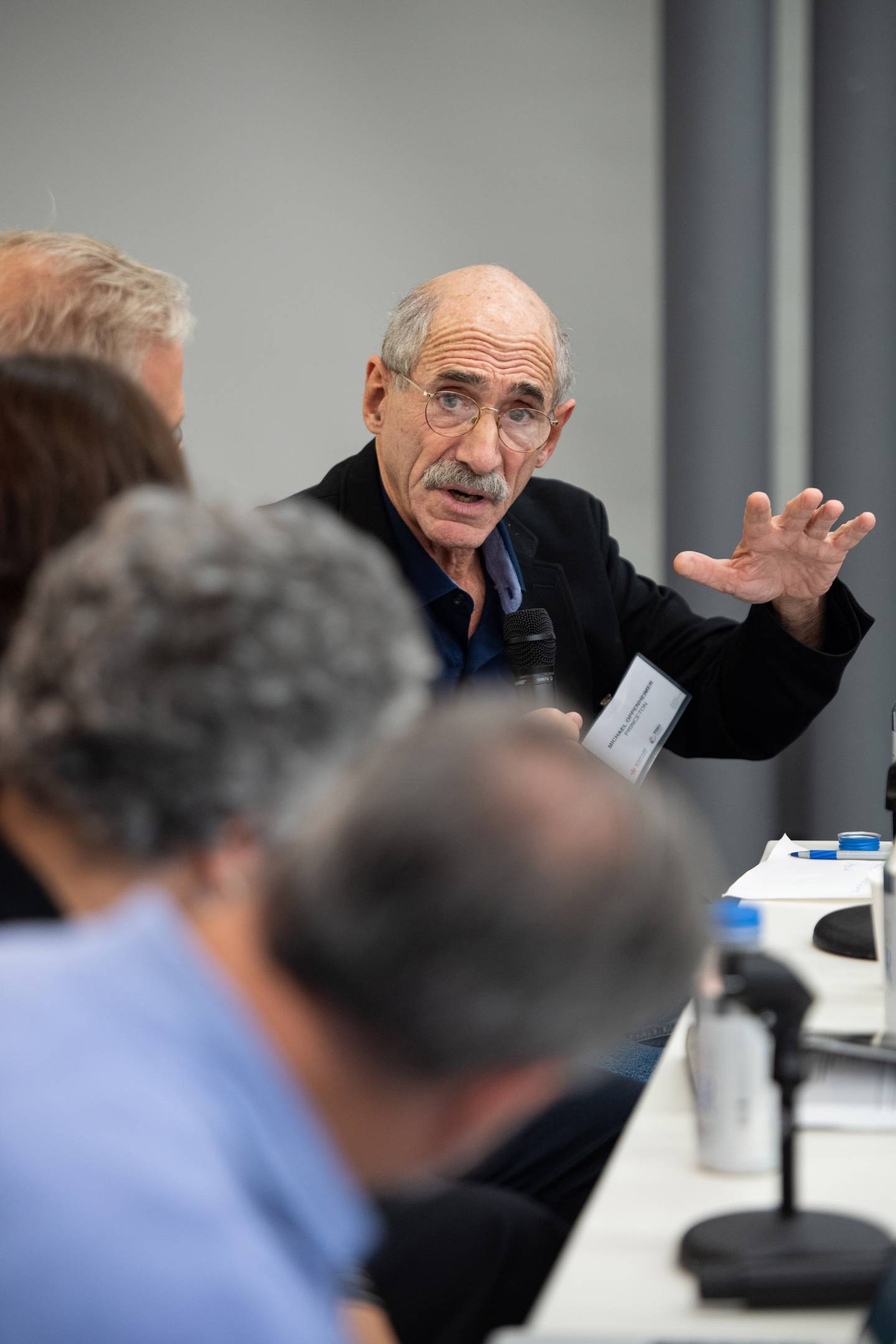 Michael Oppenheimer speaks to a group