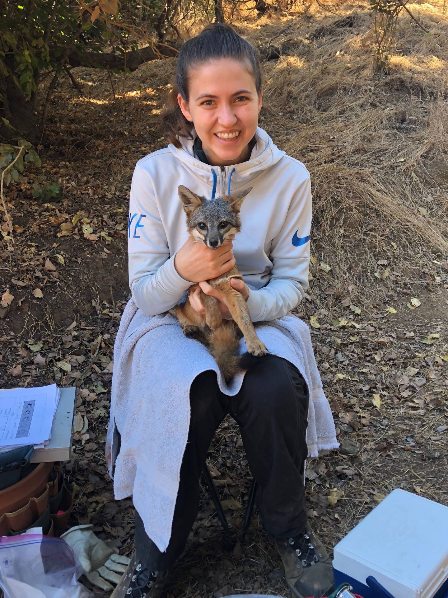 Student holding a fox