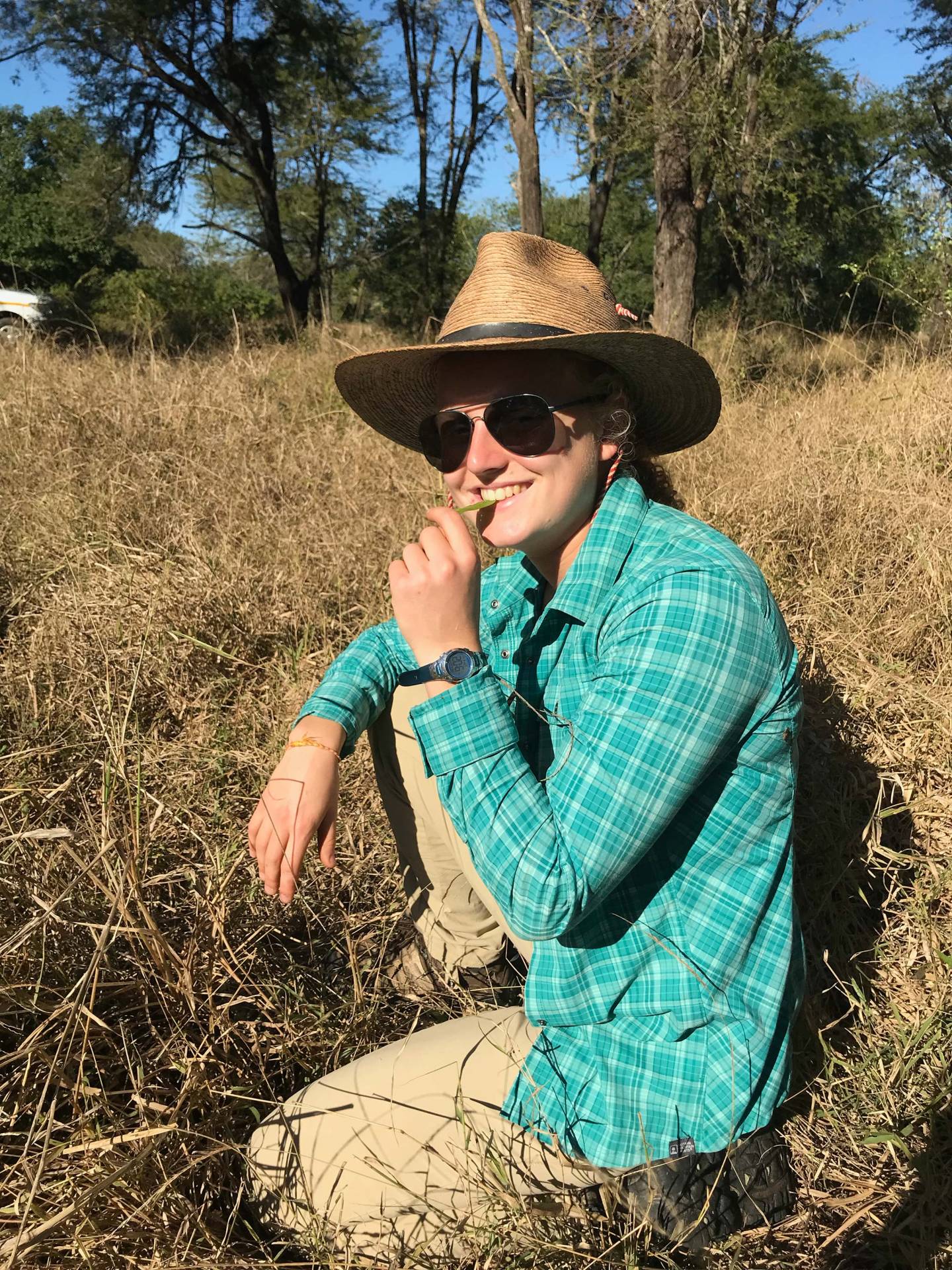 Maria Stahl sits in a field