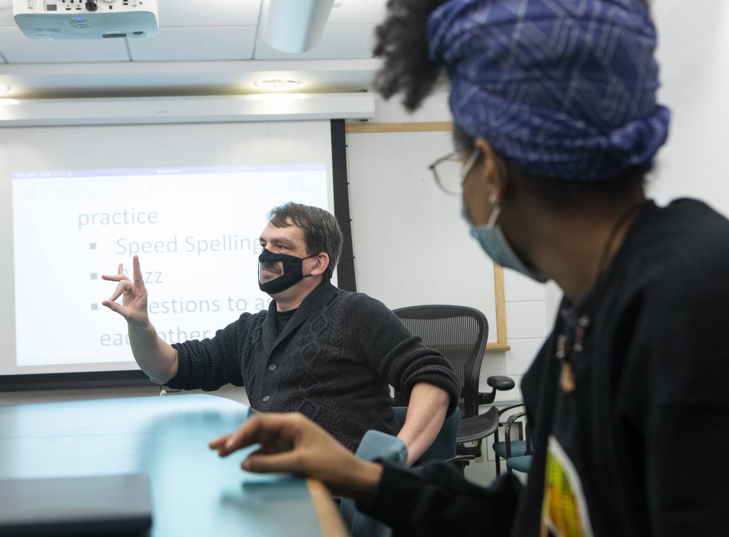 Daniel Mairer and a student in American Sign Language (ASL 102)