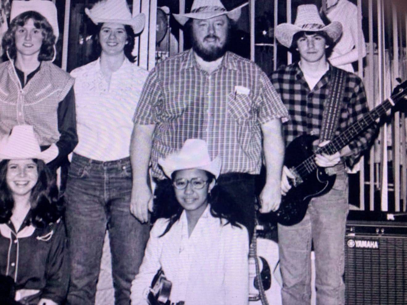 Maria Ressa as a high schooler, posing with a band