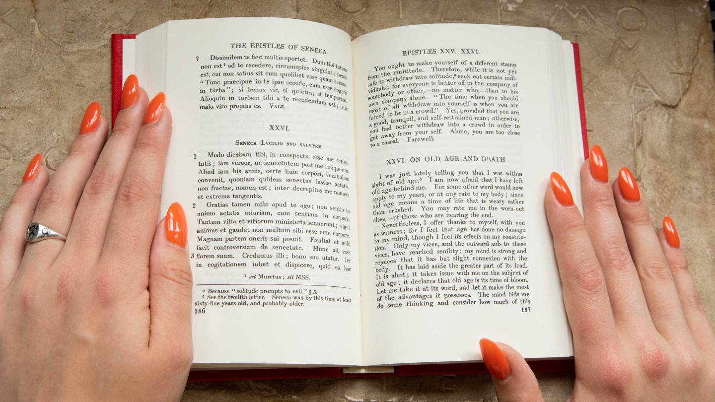 Emma Treadway's hands on a book