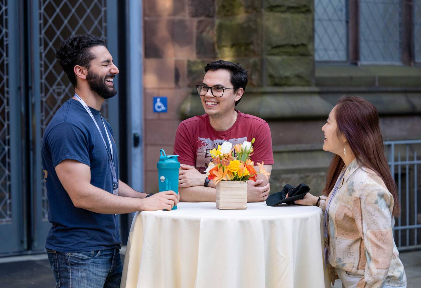 a group of students around a table at the IA Symposium