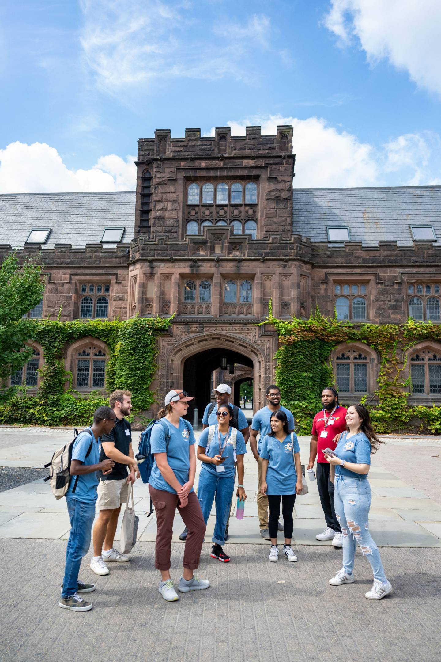 A group of grad students assemble outside East Pyne