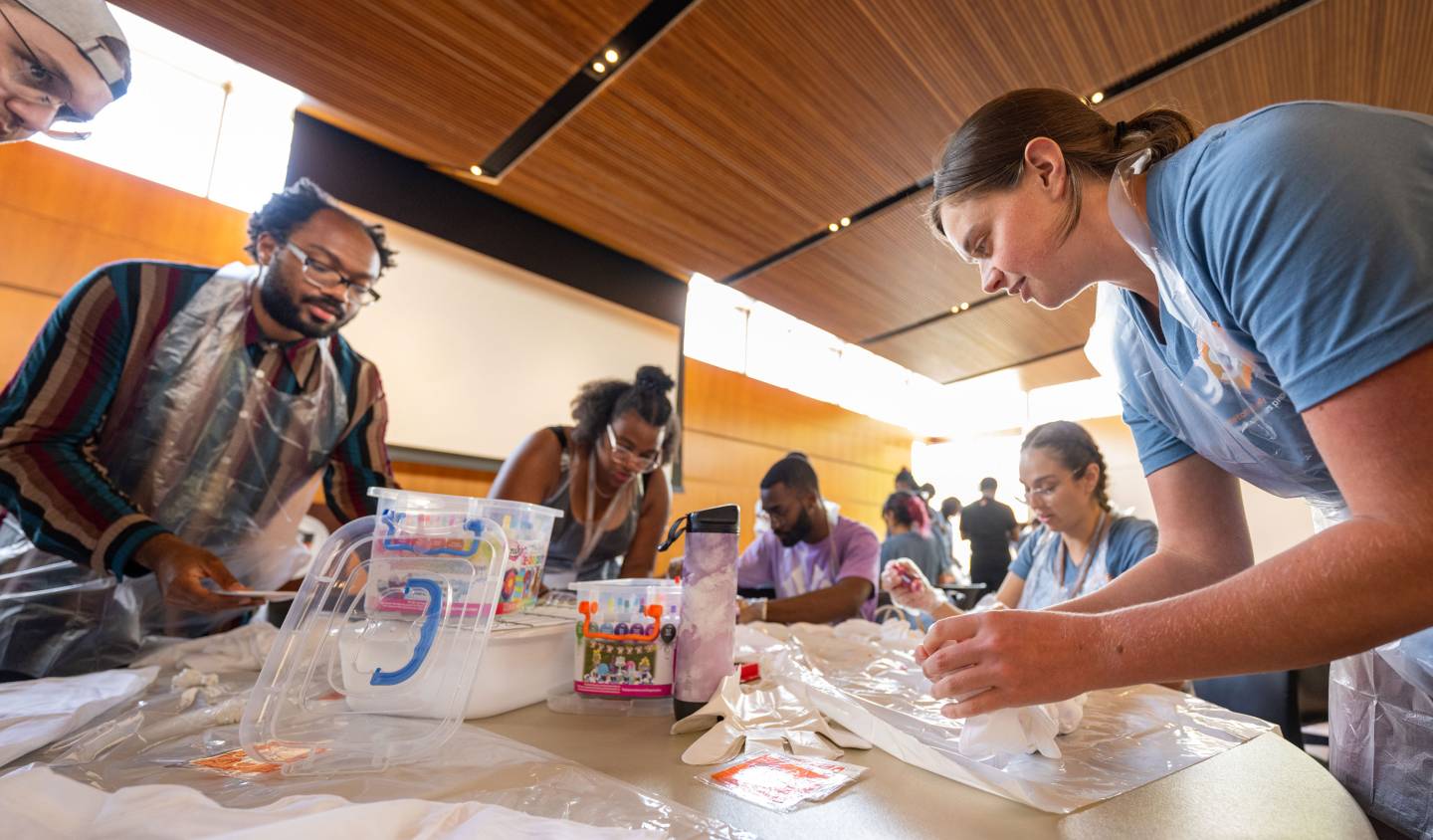 Grad students do an art activity at a retreat