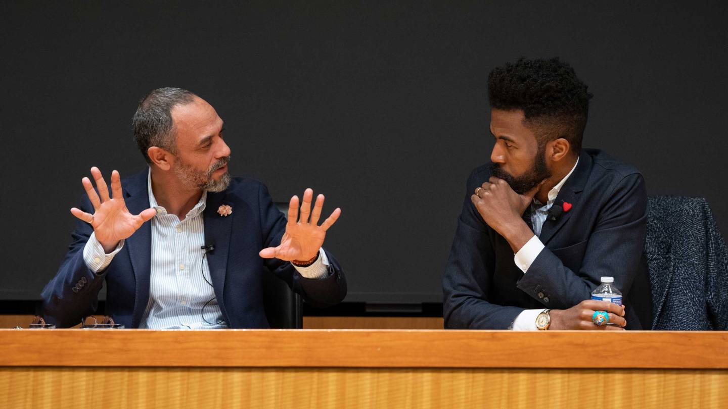 two men gesticulating 