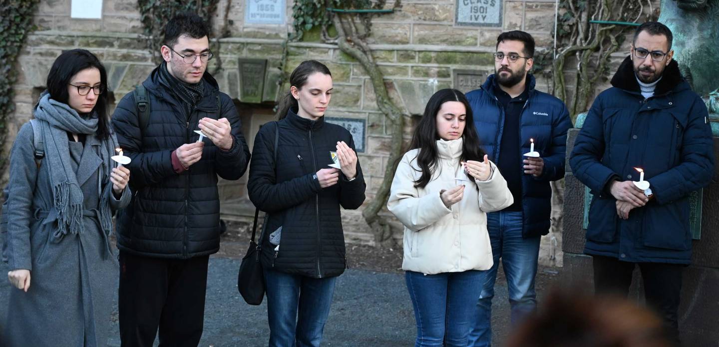 students gathering outside Nassau Hall for a vigil