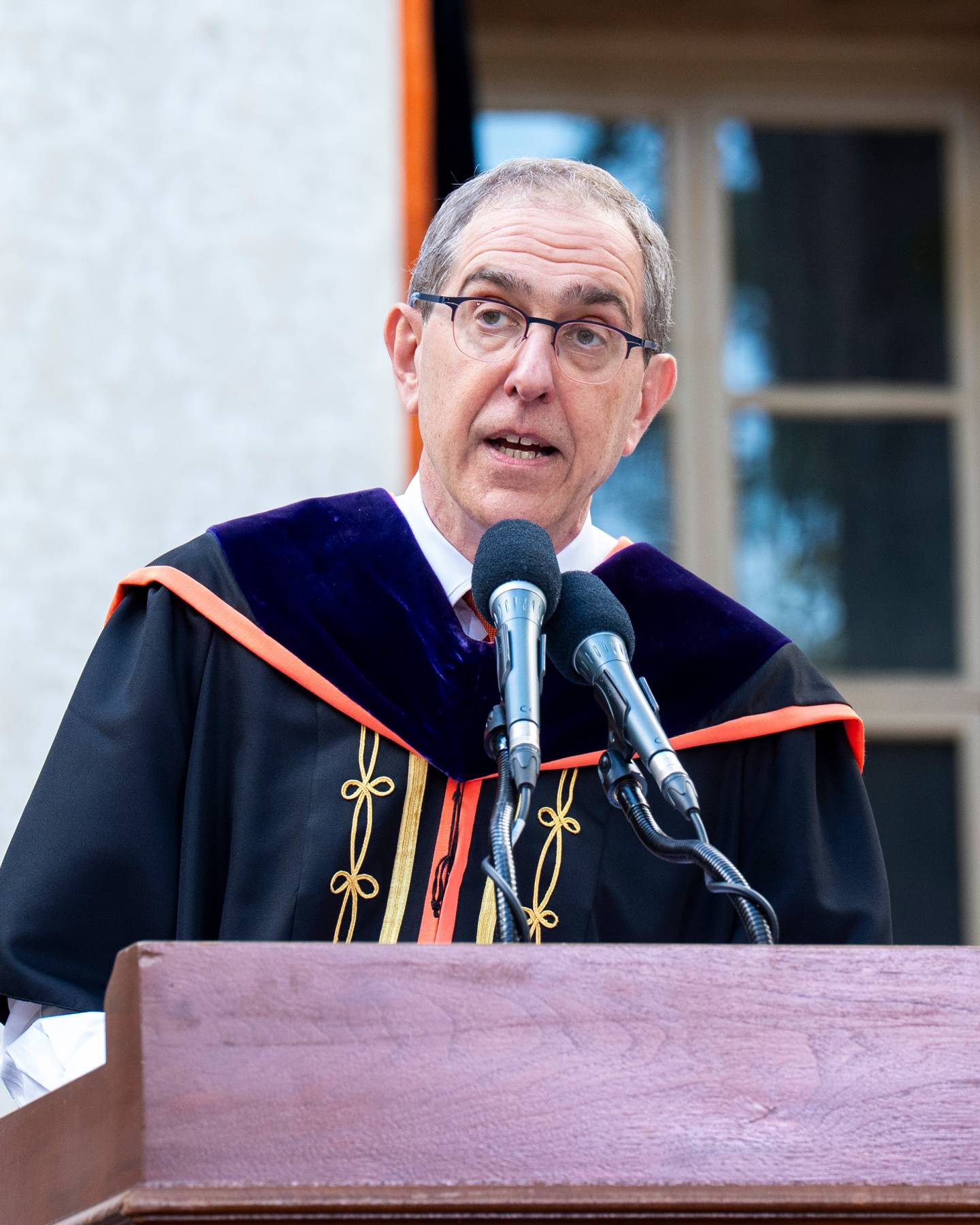 President Eisgruber speaks at the podium 