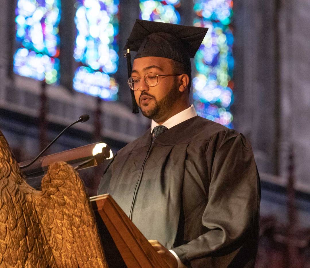 a student reads at the podium