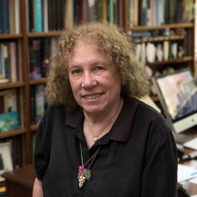 Susan Wolfson sitting in her office