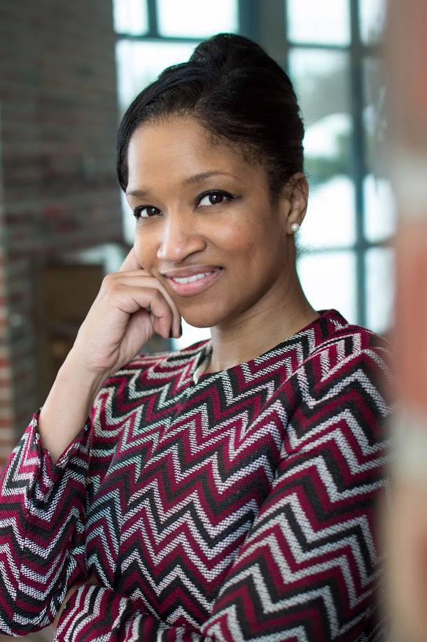 Woman leans on a doorway