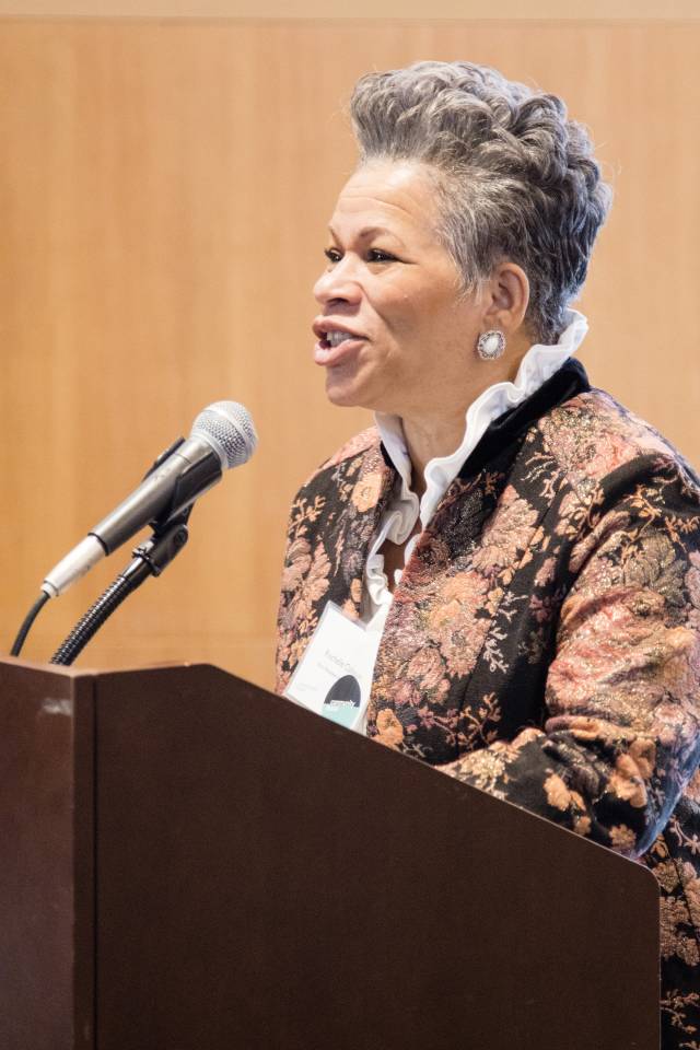 Rochelle Calhoun speaks at a podium