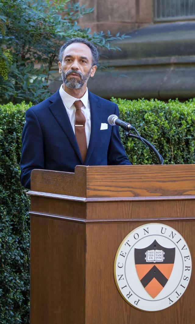 Imam Khalil Abdullah speaks at a podium
