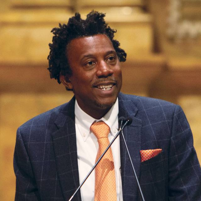 The dean addresses new grad students