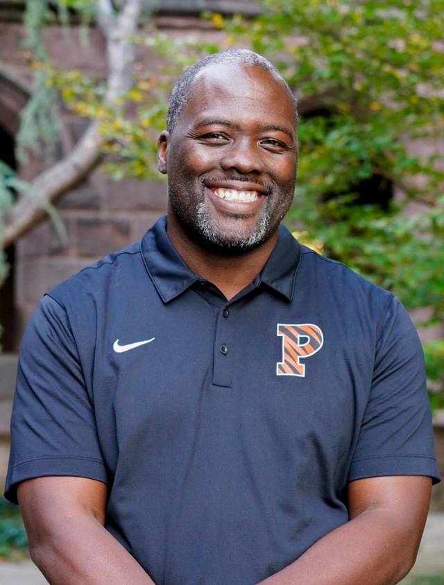 John Mack smiling at the camera