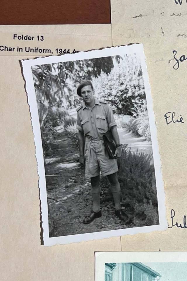 René Char standing on a field.